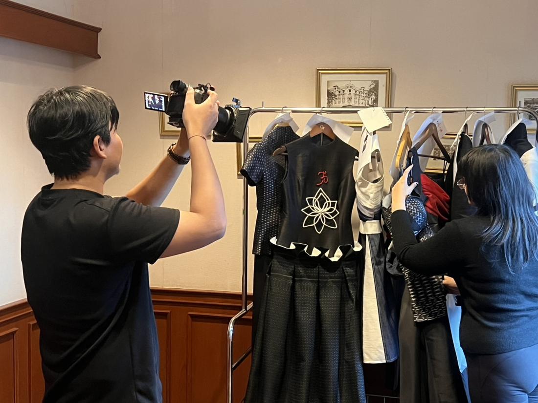 Mika styling a garment on the rack during the collection photoshoot