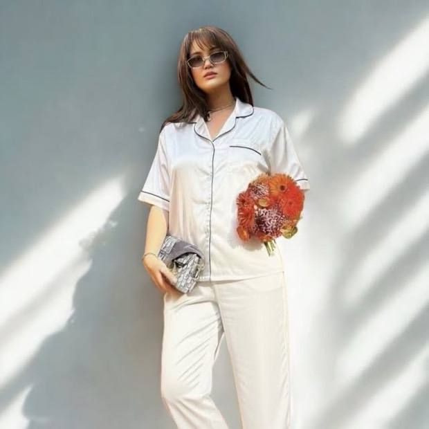 DreamWave sleepwear — white and blue pyjama set styled on a model