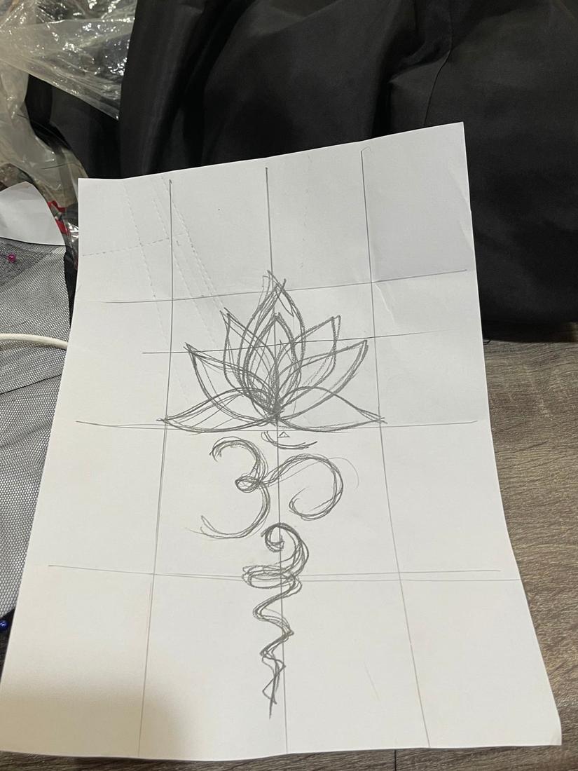 Pencil pattern sketch of a lotus and symbol motif