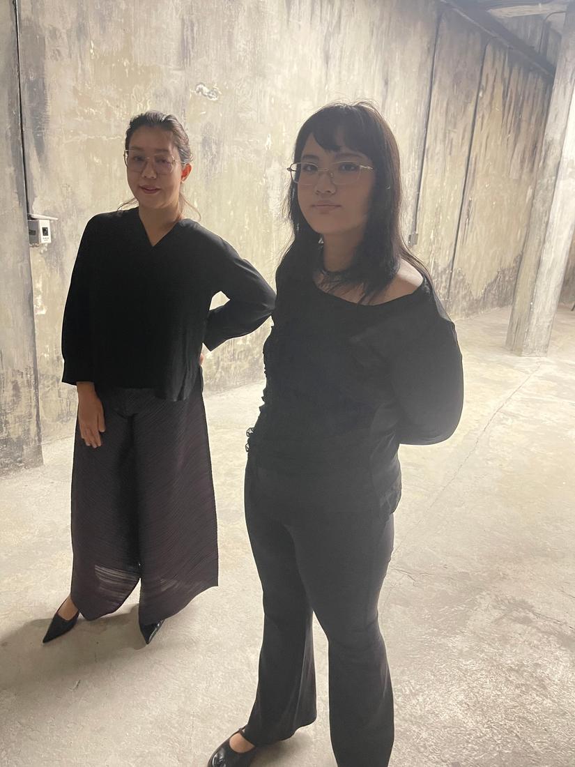 Mika with a team member on set at the editorial shoot