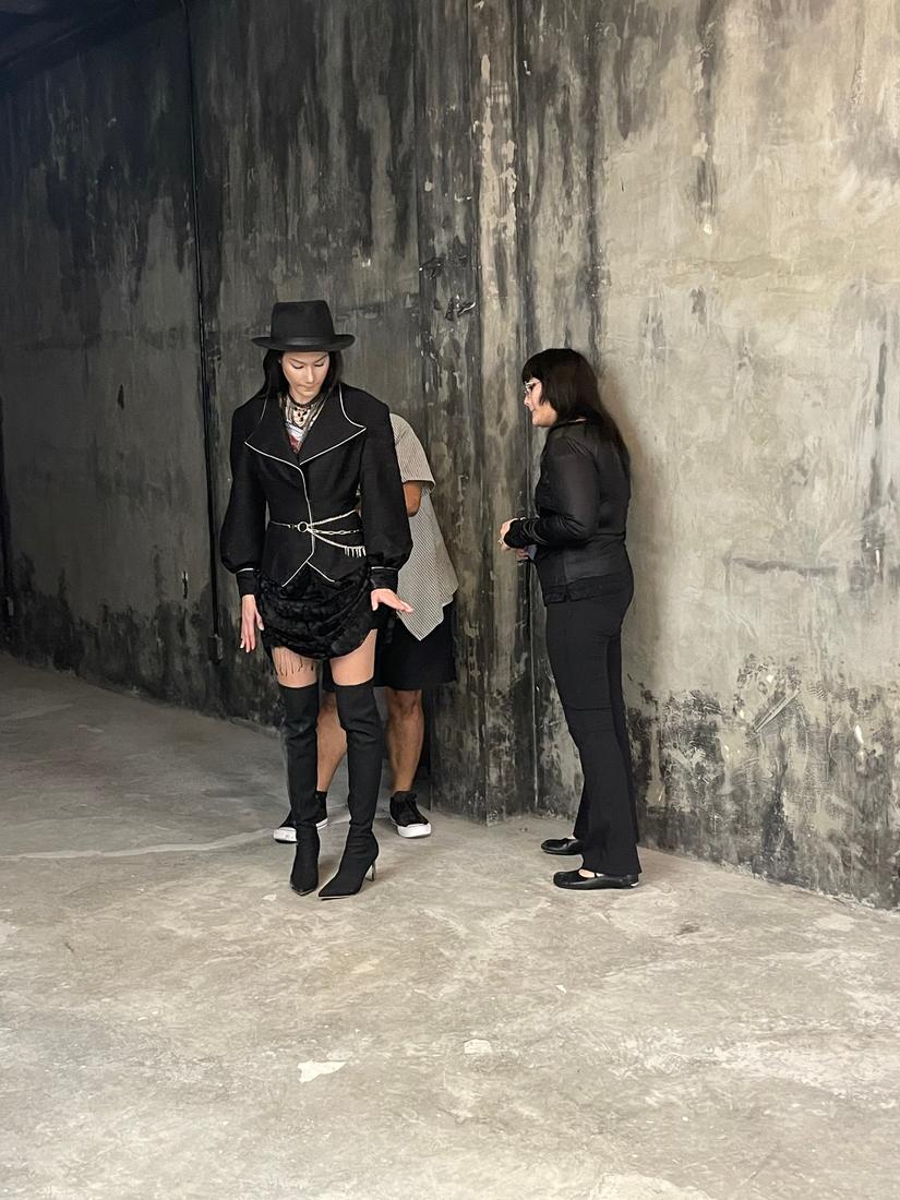 Mika checking a look on set during the editorial shoot